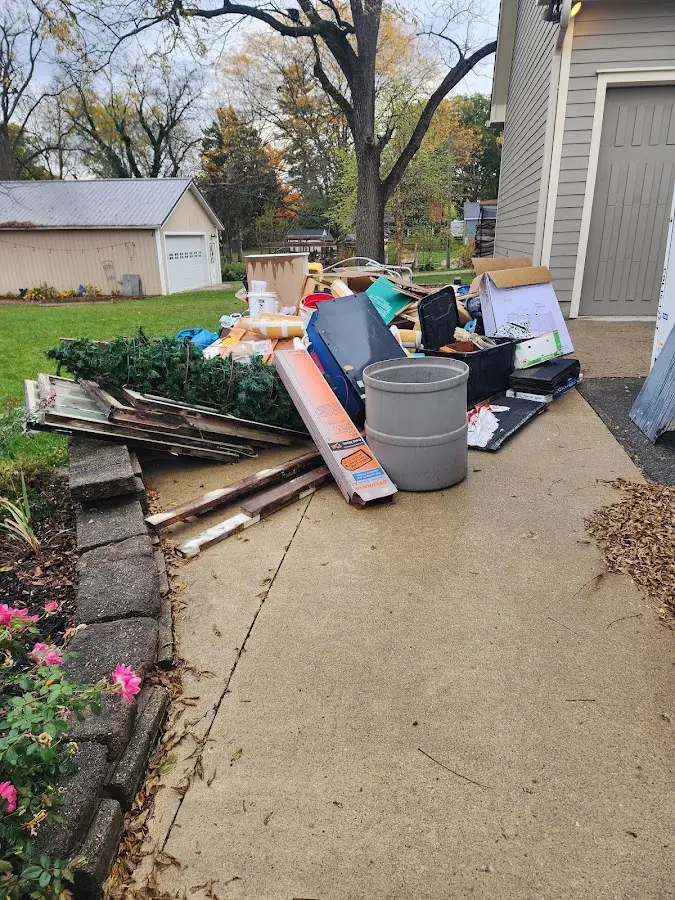 Dumpster being loaded with debris for Commercial Dumpster Rental in Washoe Valley
